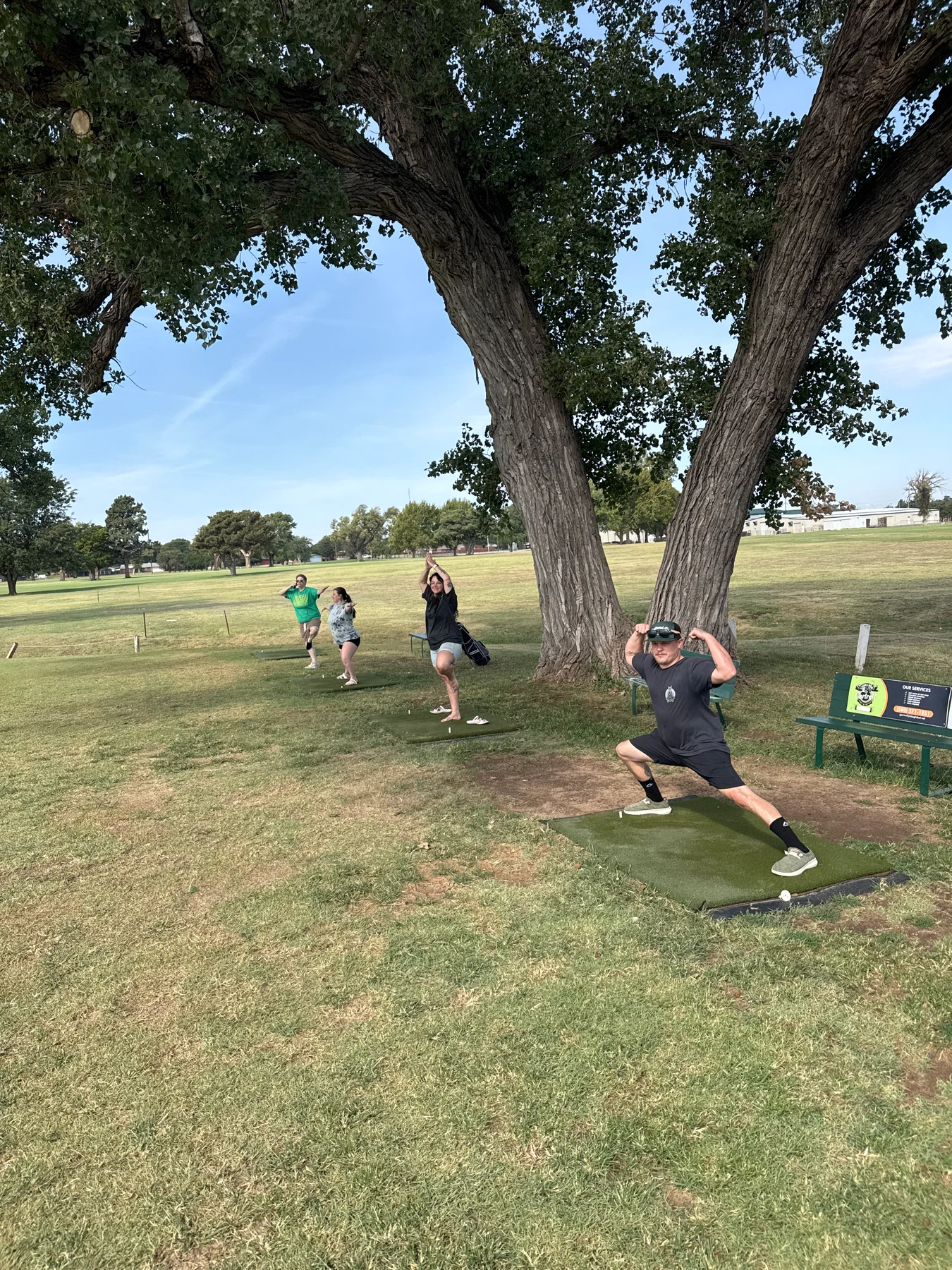 Gang Green takes on the yoga challenge around the tree.