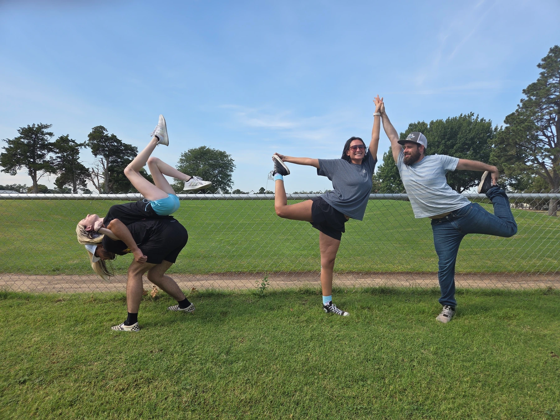 Cochina Crew balances together during the yoga challenge.