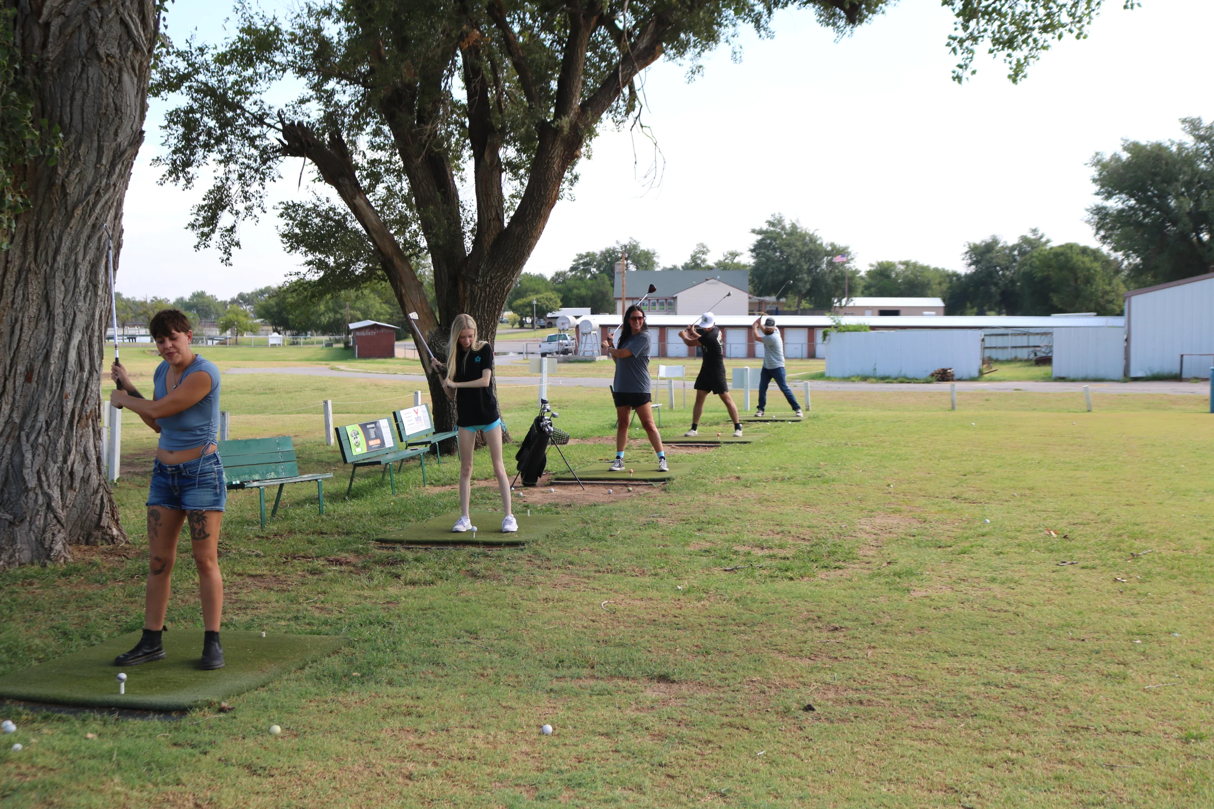 The team takes a turn at the golf challenge.
