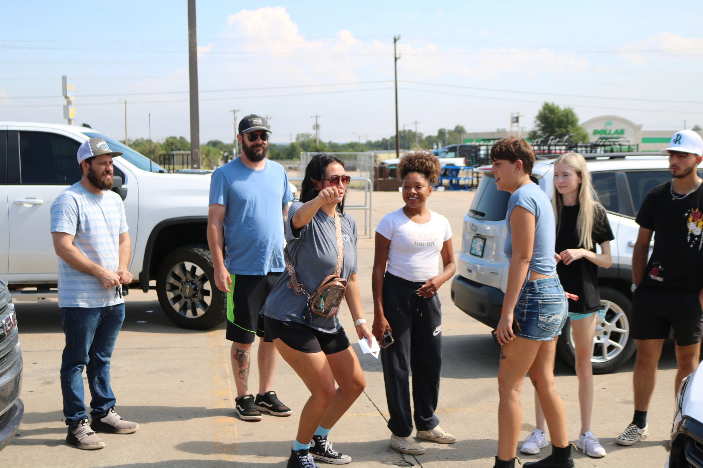 The group shares a laugh on the sidewalk.