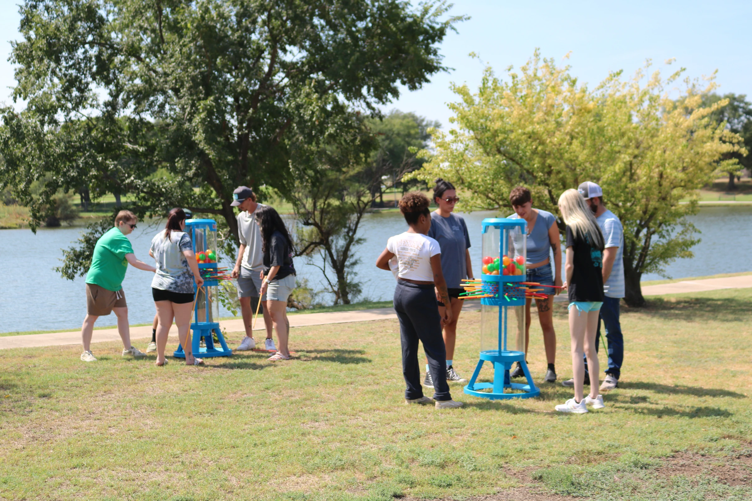 Both teams tackle giant KerPlunk by the lake.