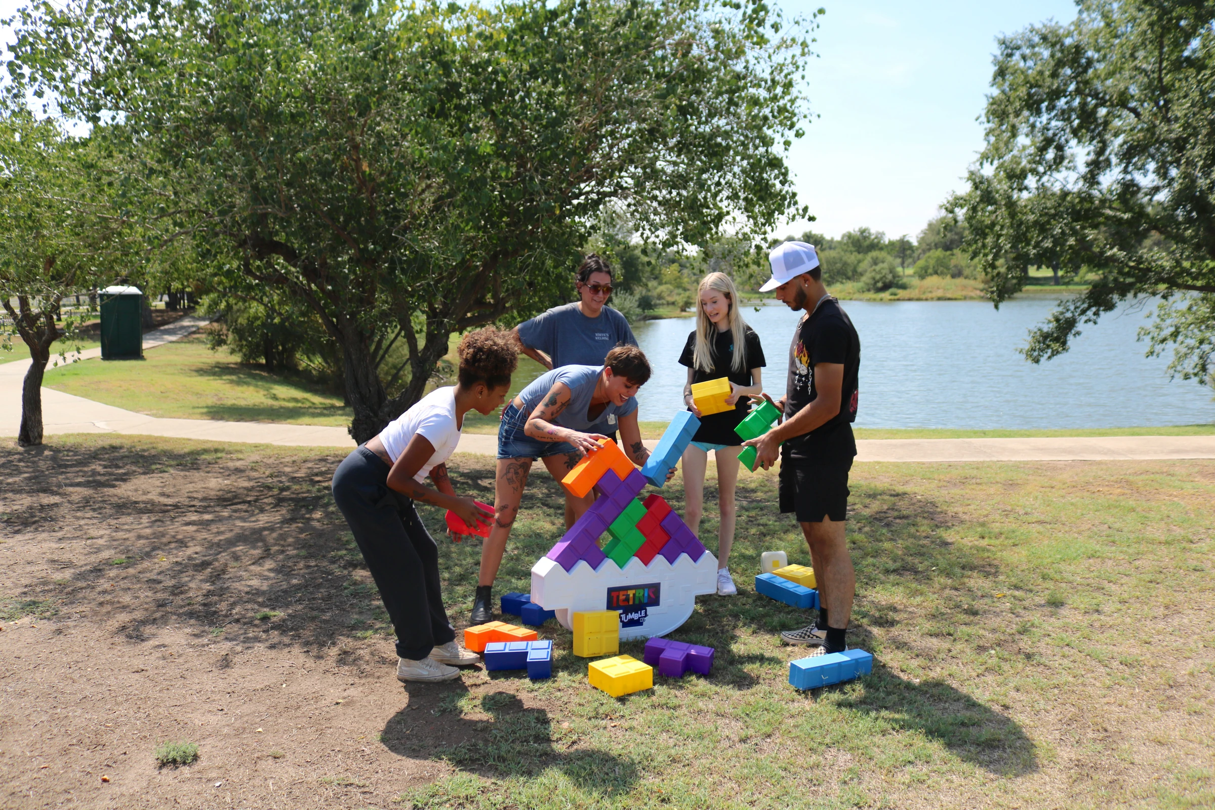 The team watches closely as another block is placed.